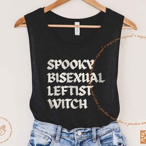 May include: Black tank top with the text "Spooky Bisexual Leftist Witch" in white lettering.
