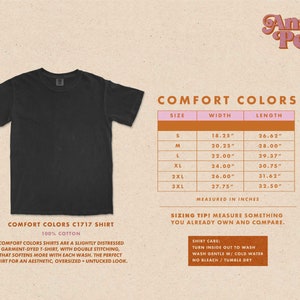 May include: A black, 100% cotton t-shirt with a distressed, garment-dyed look. The shirt has double stitching and a slightly oversized fit. The size chart shows measurements in inches for sizes S through 3XL.