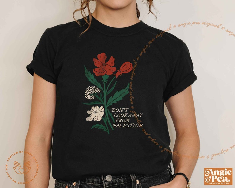 May include: Black t-shirt with a floral design and the text "Don't Look Away From Palestine".