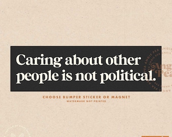 May include: A rectangular black bumper sticker or magnet with the text "Caring about other people is not political" in white. The background is a light tan color. The bottom of the image says "Choose bumper sticker or magnet".