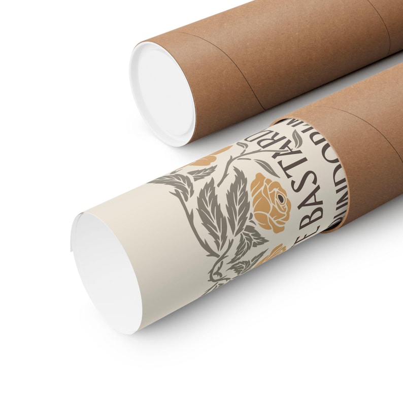 May include: Two brown cardboard poster tubes with white end caps. One tube is partially unrolled, revealing a cream-colored print with a floral design and the text "The Bastard Wind". The design features a yellow rose.