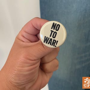 No to war button, no war button