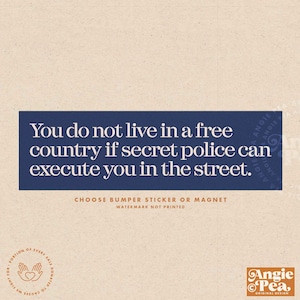 May include: A bumper sticker or magnet with a navy blue rectangle containing white text: "You do not live in a free country if secret police can execute you in the street." The text "Choose bumper sticker or magnet" is below.