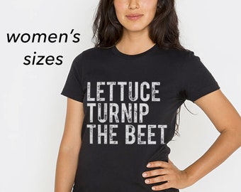 May include: Black t-shirt with white text that reads "Lettuce Turnip The Beet".