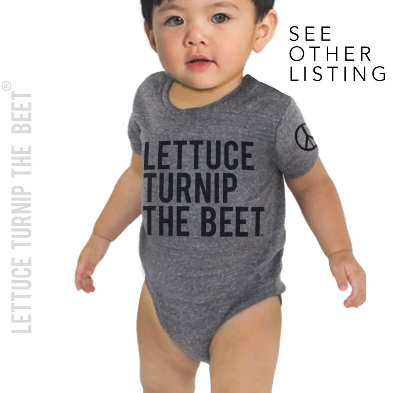 May include: A gray baby onesie with the text "Lettuce Turnip The Beet" printed in black. The onesie has a peace sign on the sleeve.