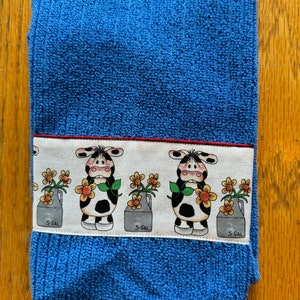Bright Blue Kitchen Towel with Cute Colored Cows, Antique Milk Jugs, and Yellow Flowers