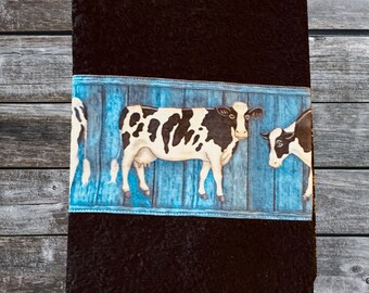 Black Kitchen Towel with Black & White Cows on Blue Background