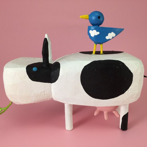 cow with bluebird buddy
