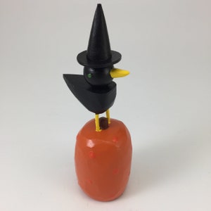 witch crow on a pumpkin | halloween decoration