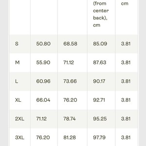 May include: A white chart with black text detailing garment measurements. The chart includes width, length, and sleeve length in centimeters, along with size tolerance. Sizes range from S to 4XL, with corresponding measurements.