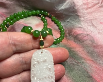 Amazing green jade necklace with hand carved white jade pendant