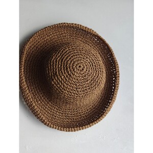 May include: A set of three ceramic vases in varying heights and shapes. The vases are glazed in a matte white finish, offering a minimalist aesthetic. The tallest vase is approximately 10 inches high.