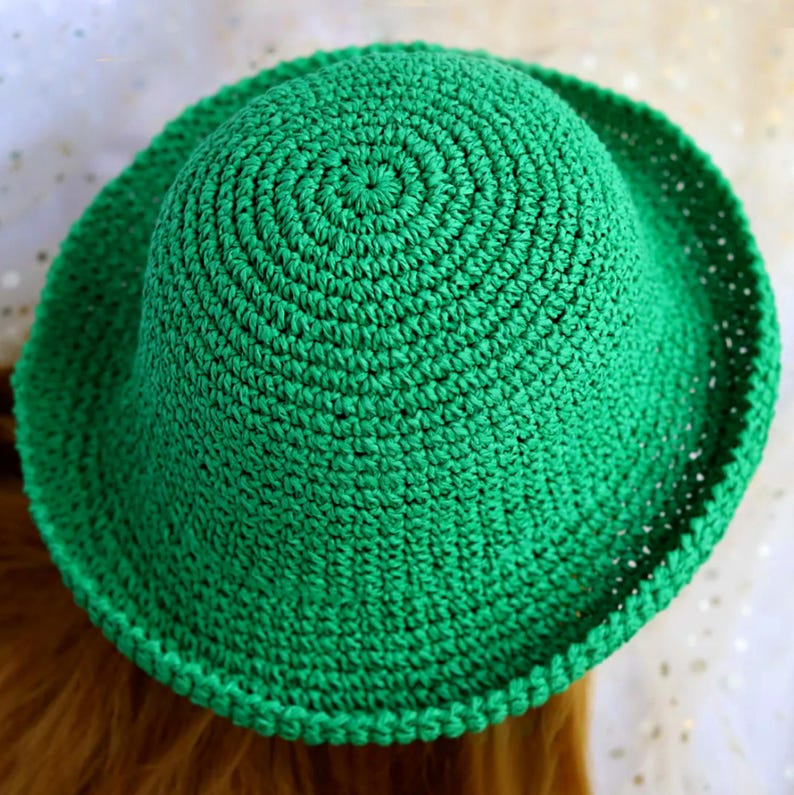 May include: A set of three ceramic mugs with a speckled, matte finish. The mugs are in shades of cream, light brown, and dark brown. Each mug has a simple, minimalist design, perfect for coffee or tea.