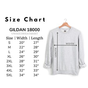 May include: Size chart for Gildan 18000 unisex sweatshirt. The chart shows the width and length measurements in inches for sizes S through 5XL.