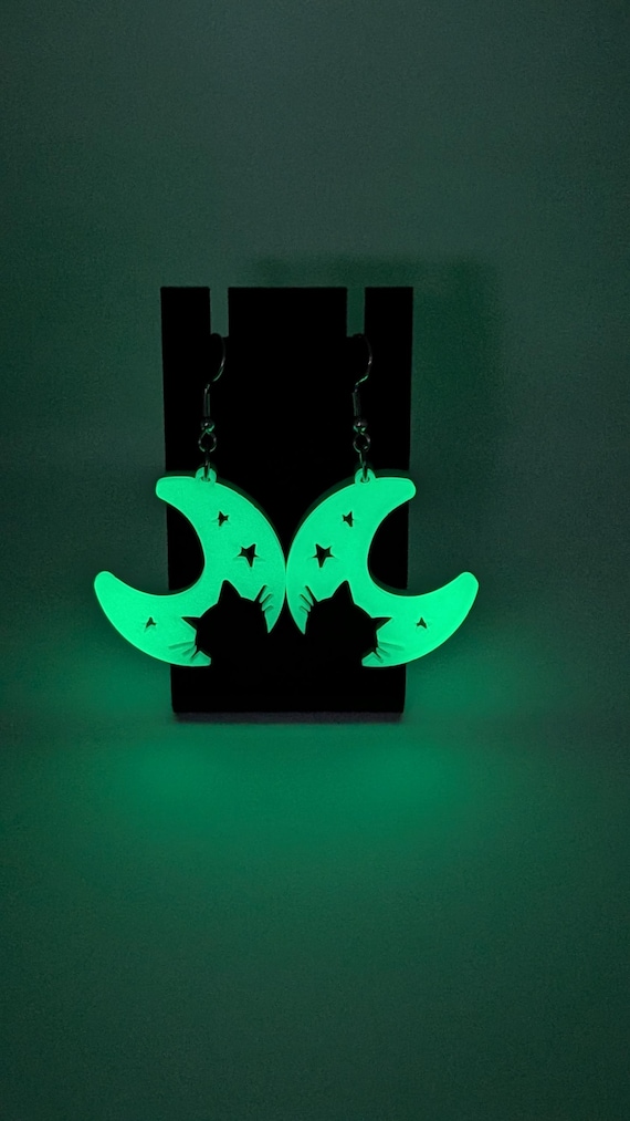 Laser-cut glow-in-the-dark cat in moon earrings