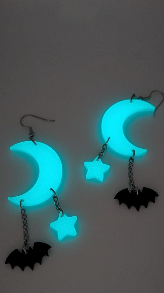 Glow-in-the-dark moon, star, and bat earrings