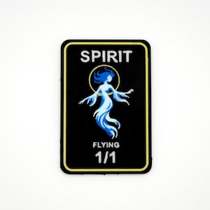 May include: Black rectangular patch with a yellow border featuring a blue and white spirit figure. The word "SPIRIT" is at the top, with "FLYING" and "1/1" at the bottom. The spirit figure has flowing hair and arms.