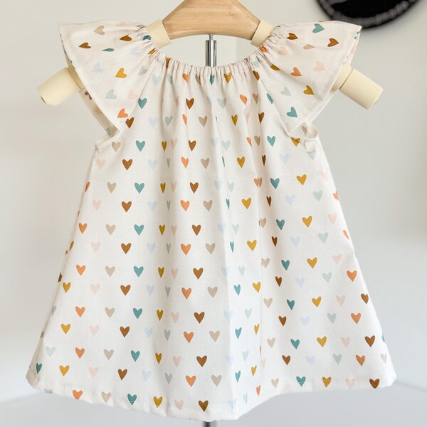 Babyhug Woven Sleeveless Party Dress With Heart Print & Bow Applique - White main image 1