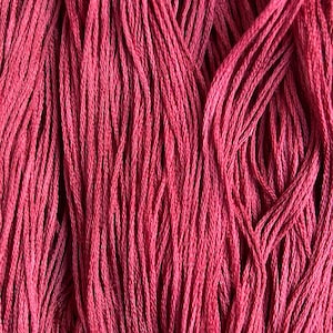 May include: Close-up of a bundle of red embroidery floss. The threads are tightly packed together, creating a textured surface. The color is a deep, vibrant red, with subtle variations in tone.