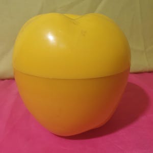 Vintage plastic apple ice bucket with yellow ice cubes