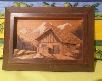 Carved wooden painting of a mountain chalet landscape signed