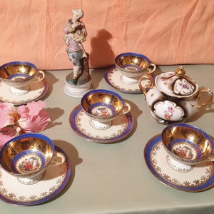 Saxon porcelain cup from Germany with Erdmann saucer, SCHLEGELMILCH