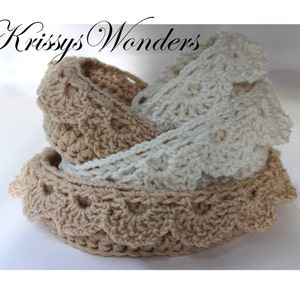May include: Three crocheted lace trims in beige and white. The trims are folded and stacked on top of each other.