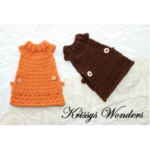 May include: Two crocheted sleeveless tops, one orange and one brown, with wooden buttons. The tops are laid out on a white lace background. The text "Krissys Wonders" is visible below the tops.