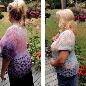 May include: A crocheted top with a gradient of pink, purple, and blue colors. The top has a scalloped hem and short sleeves. The top is shown on a person standing in a garden.
