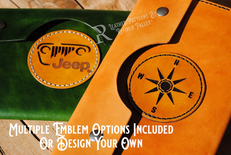 May include: Two leather wallets with different designs. The wallet on the left has a green leather exterior with a tan leather Jeep logo. The wallet on the right has a tan leather exterior with a tan leather compass design. The text "MULTIPLE EMBLEM OPTIONS INCLUDED OR DESIGN YOUR OWN" is printed on the wooden surface below the wallets.