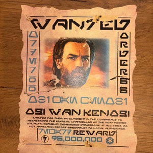 Peut inclure: Une affiche de recherche de style vintage avec un fond jauni et délavé. L'affiche présente le portrait d'un homme aux cheveux bruns et à la barbe. Le texte sur l'affiche indique "WANTED" et "ABI WAN KENOBI" avec une récompense de 95 000 000 crédits.