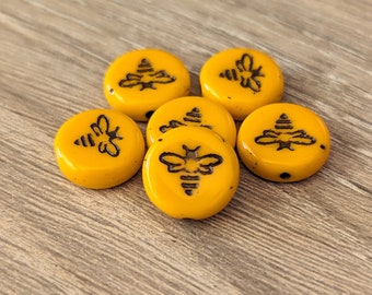 6 lub 12 szt. koralików Coin Bee w kolorze nagietka z ciemnym brązem - czeskie szkło prasowane, 12 mm