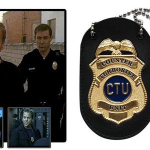 May include: A black leather CTU badge with a gold-colored emblem and a silver ball chain necklace. The emblem features the words "Counter Terrorist Unit" and "CTU" in a blue circle. The image also shows a scene from the TV show 24.