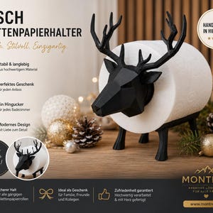 Könnte beinhalten: Ein schwarz-weißer Toilettenpapierhalter in Form eines Hirsches. Der Hirsch hat ein großes Geweih und hält eine Rolle weißes Toilettenpapier. Der Halter steht auf einer Holzoberfläche mit dekorativen Ornamenten.