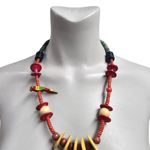 May include: A rustic wooden sign with the text "Welcome" in a handwritten style. The sign is painted white with a distressed finish, and a small, decorative heart is attached to the bottom. The background is a blurred image of a wooden surface.