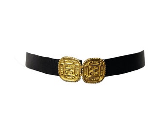 Paquette gold statement buckle faux leather belt . fits up to waist 42"