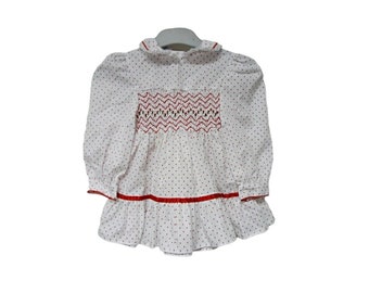 Polly Flinders . hand smocked red and white polka dotted long sleeve dress . size 2T