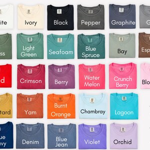 a collection of 24 t-shirts in various colors, arranged in a grid pattern.