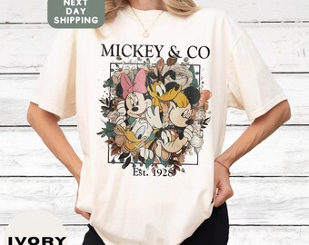 Mickey & Co Disney Graphic Tee with Minnie, Donald, and Pluto, Vintage Style Oversized Shirt for Disney Fans, Established 1928 Design