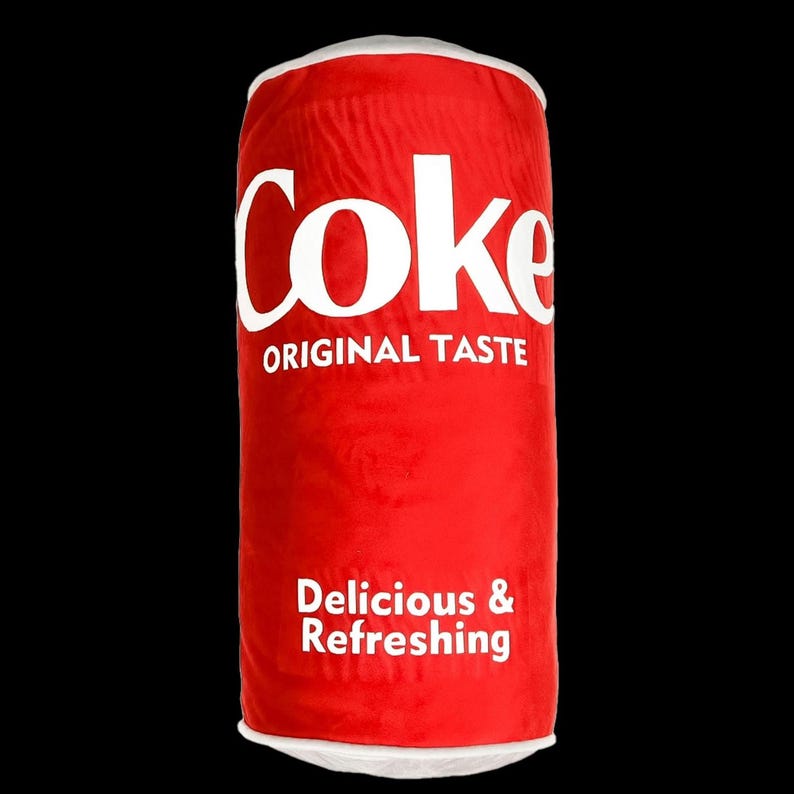 a can of coke on a white background