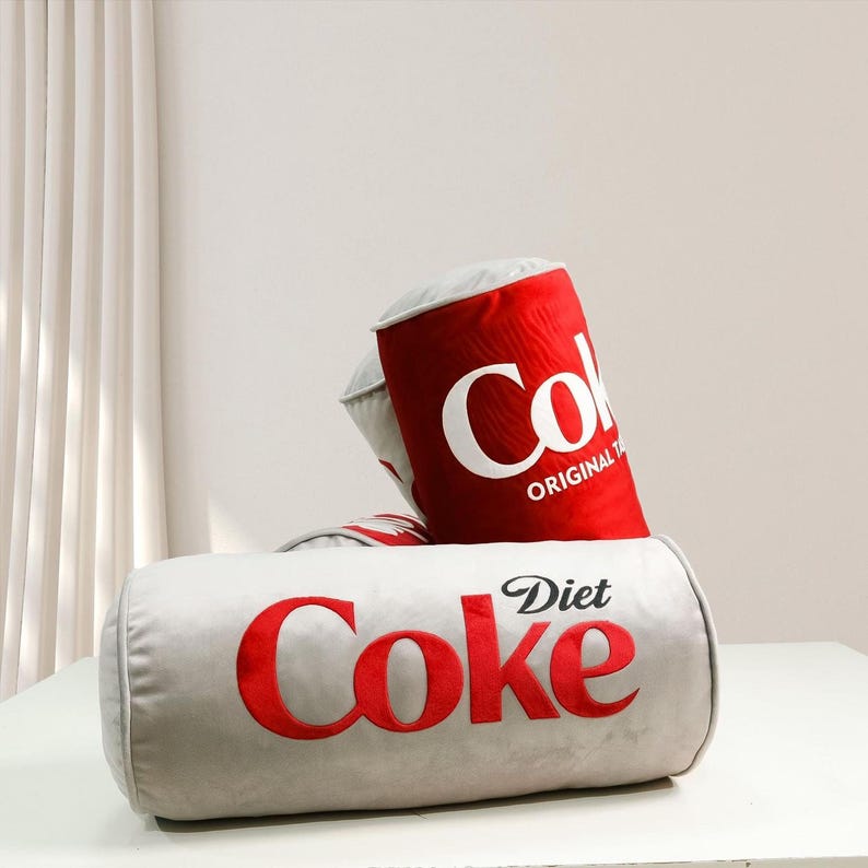 a diet coke can sitting on top of a bag