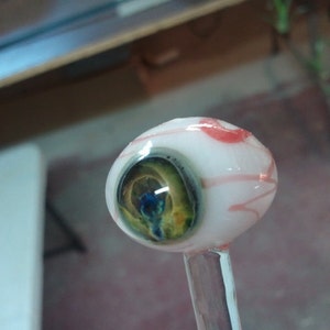 One Multi Colored Glass Eyeball Plant Stick Sculpted by Jenn Goodale