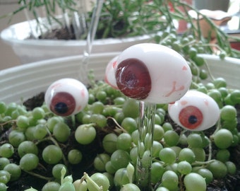 One, Hand Sculpted Brown Glass Eye Ball plant Stick Created by Jenn Goodale