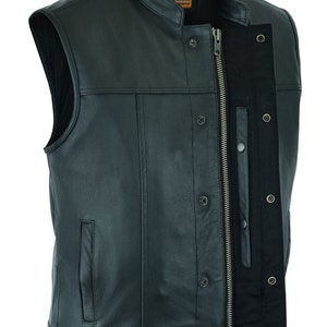 May include: A black leather motorcycle vest with a zipper closure and snap buttons. The vest has a stand-up collar and two pockets on the front.