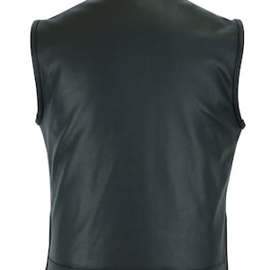 May include: Black leather vest with a zipper closure. The vest has a plain design and no pockets.