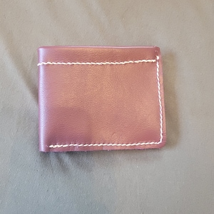 Cartera cosida a mano