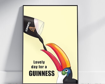 Puede incluir: Un tucán con un gran pico naranja está bebiendo de un vaso de cerveza Guinness. El texto "Lovely day for a GUINNESS" está debajo del tucán.