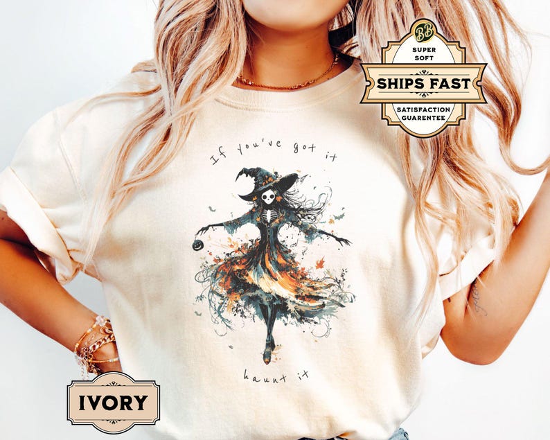 A spooky yet chic t-shirt design featuring a dancing skeleton girl in a flowing gown, holding a jack-o-lantern, with the phrase If You've Got It, Haunt It. Perfect for Halloween enthusiasts, gothic fashion fans, and stylish Halloween events.