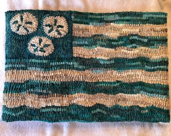 Beach Flag rug hooking pattern on linen with sand dollars for you to hook !  Seafoam  and sand