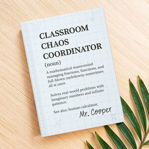May include: A notebook with a blue grid pattern features the text "CLASSROOM CHAOS COORDINATOR" in black. The text describes the role of a mathematical mastermind. The signature "Mr. Cooper" is at the bottom.